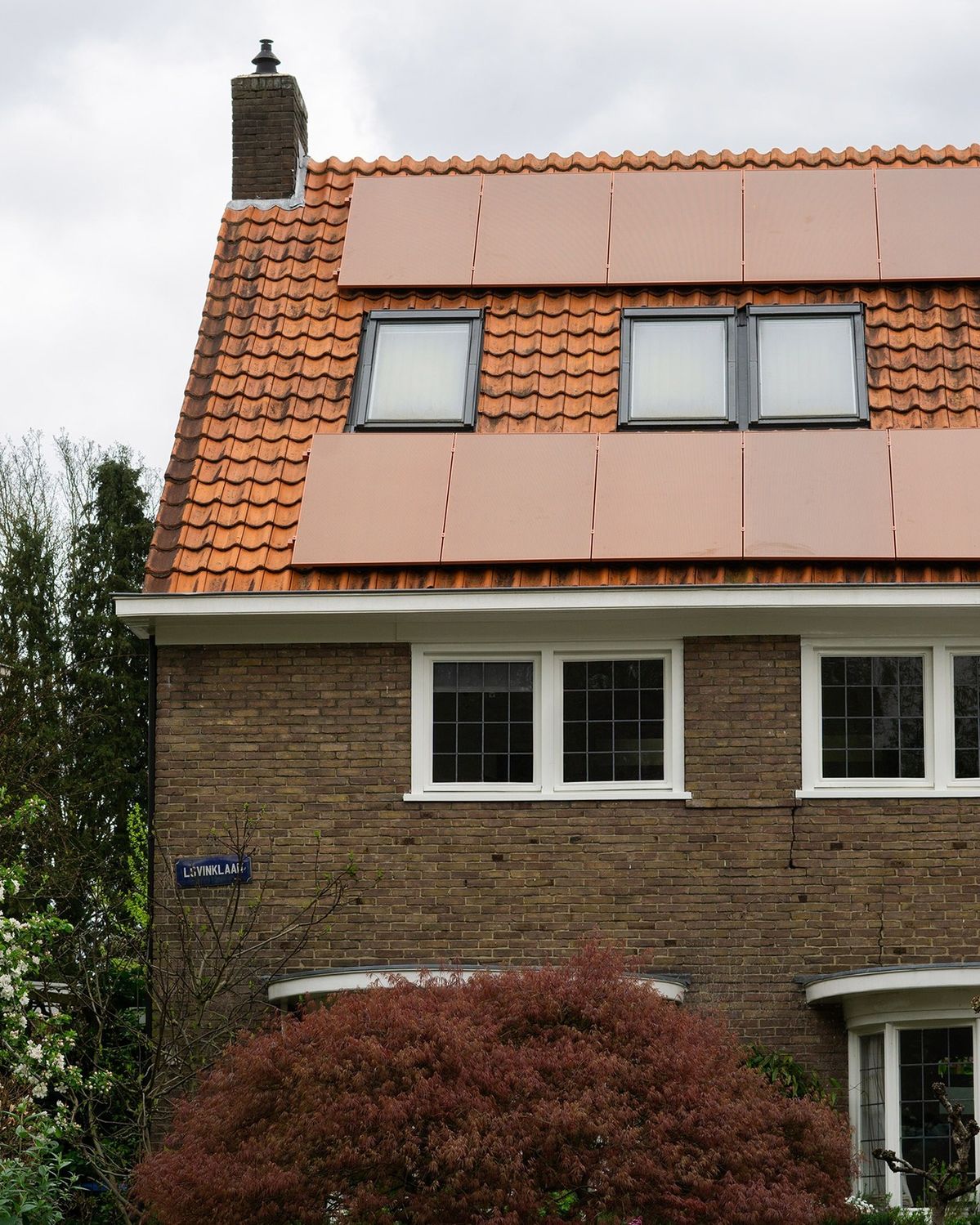 Solar sunroof villa reference with integrated photovoltaic roof panels